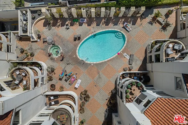 a view of a house with swimming pool and porch