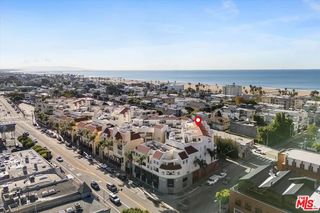 an aerial view of a building with outdoor space