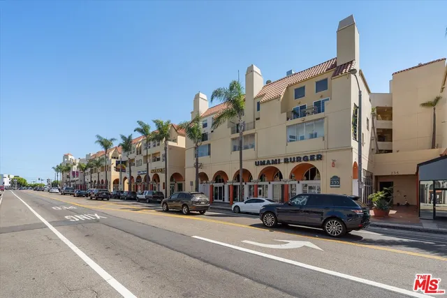 a view of a hallway with paintings on the wall