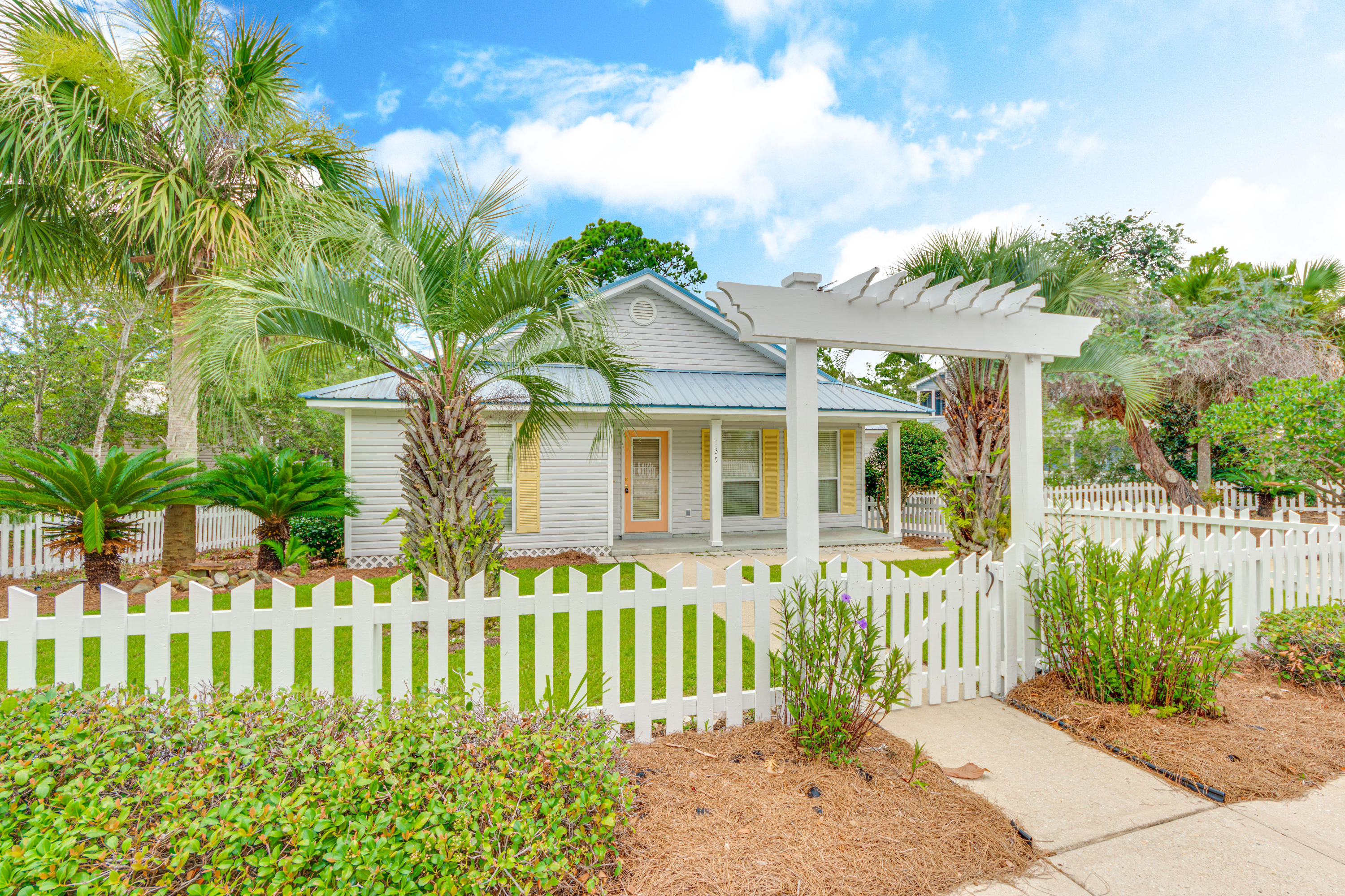 135 Gulfwinds Way Santa Rosa Beach, FL 32459 - Photo 2 of 51 a front view of a house with a garden