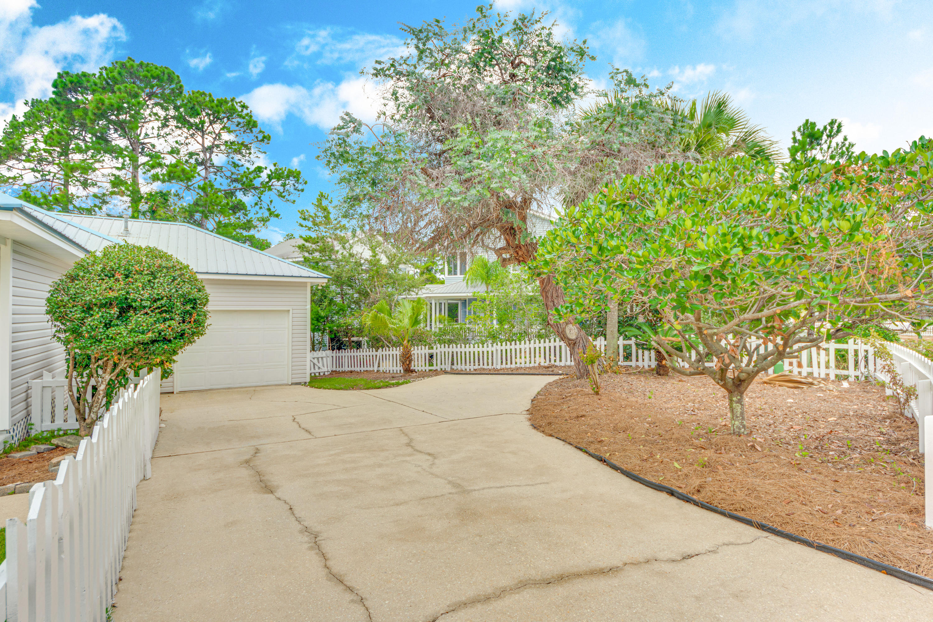 135 Gulfwinds Way Santa Rosa Beach, FL 32459 - Photo 3 of 51 a pathway of a house with a yard