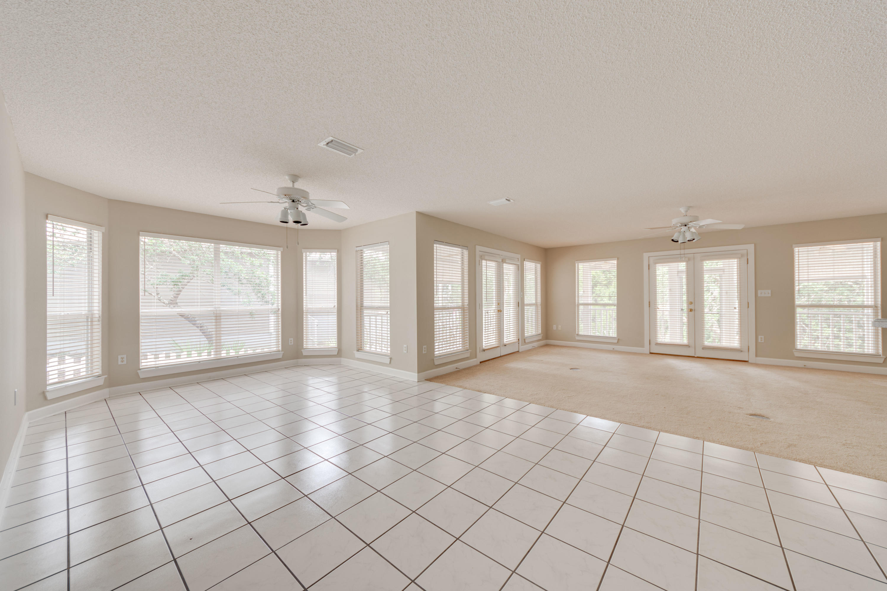 135 Gulfwinds Way Santa Rosa Beach, FL 32459 - Photo 31 of 51 a view of an empty room with a window and a kitchen