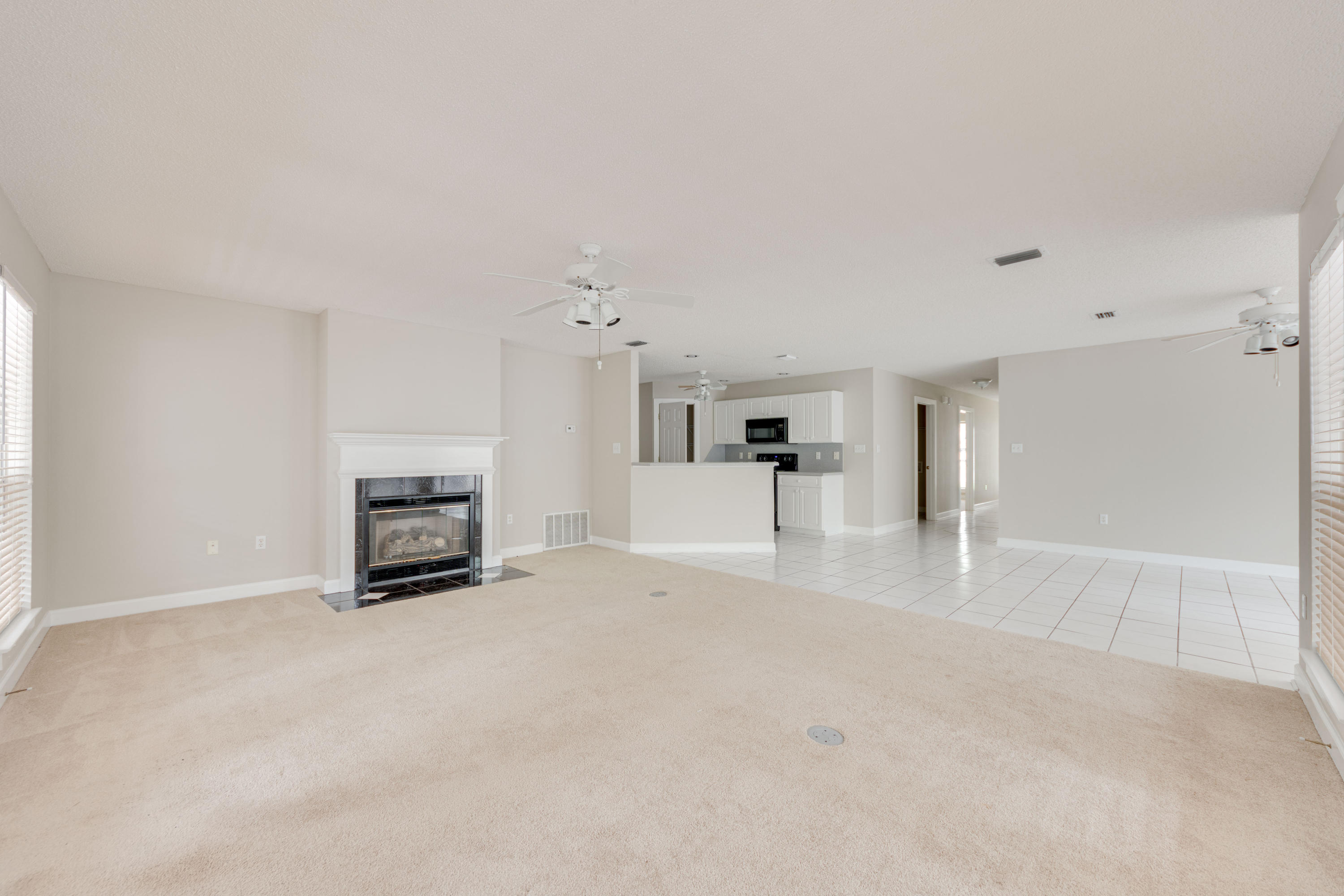 135 Gulfwinds Way Santa Rosa Beach, FL 32459 - Photo 36 of 51 a view of an empty room with a fireplace