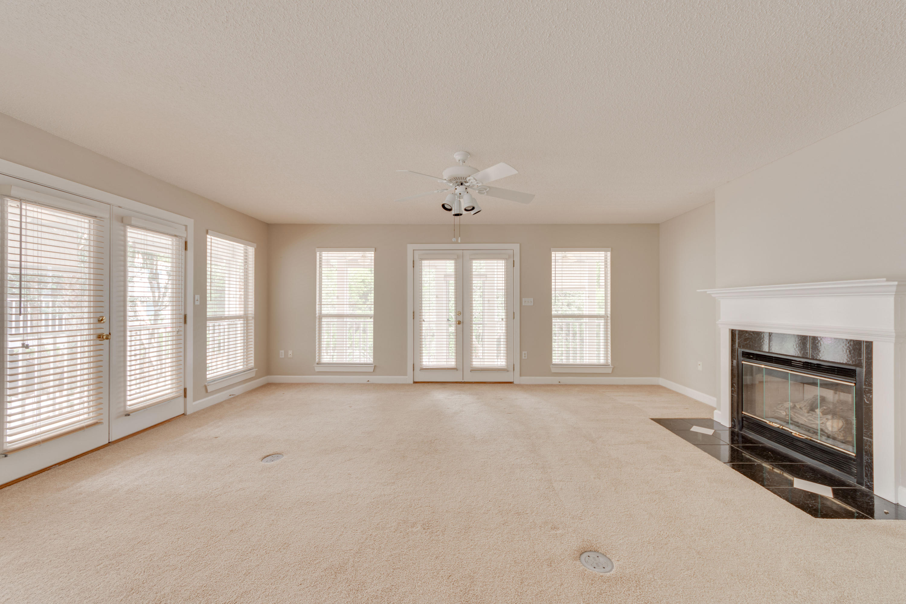 135 Gulfwinds Way Santa Rosa Beach, FL 32459 - Photo 37 of 51 an empty room with windows and fireplace