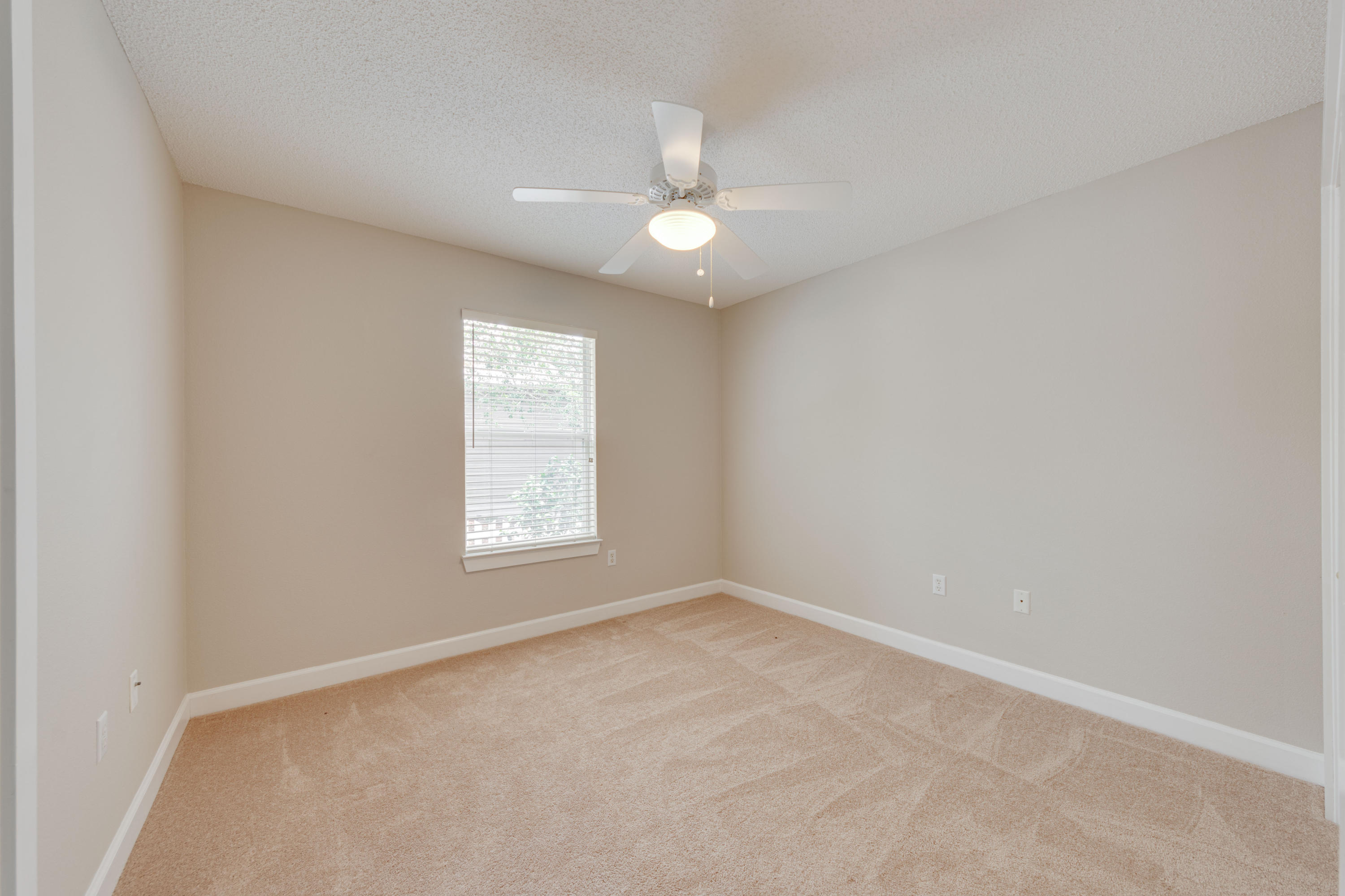 135 Gulfwinds Way Santa Rosa Beach, FL 32459 - Photo 43 of 51 an empty room with a window and ceiling fan