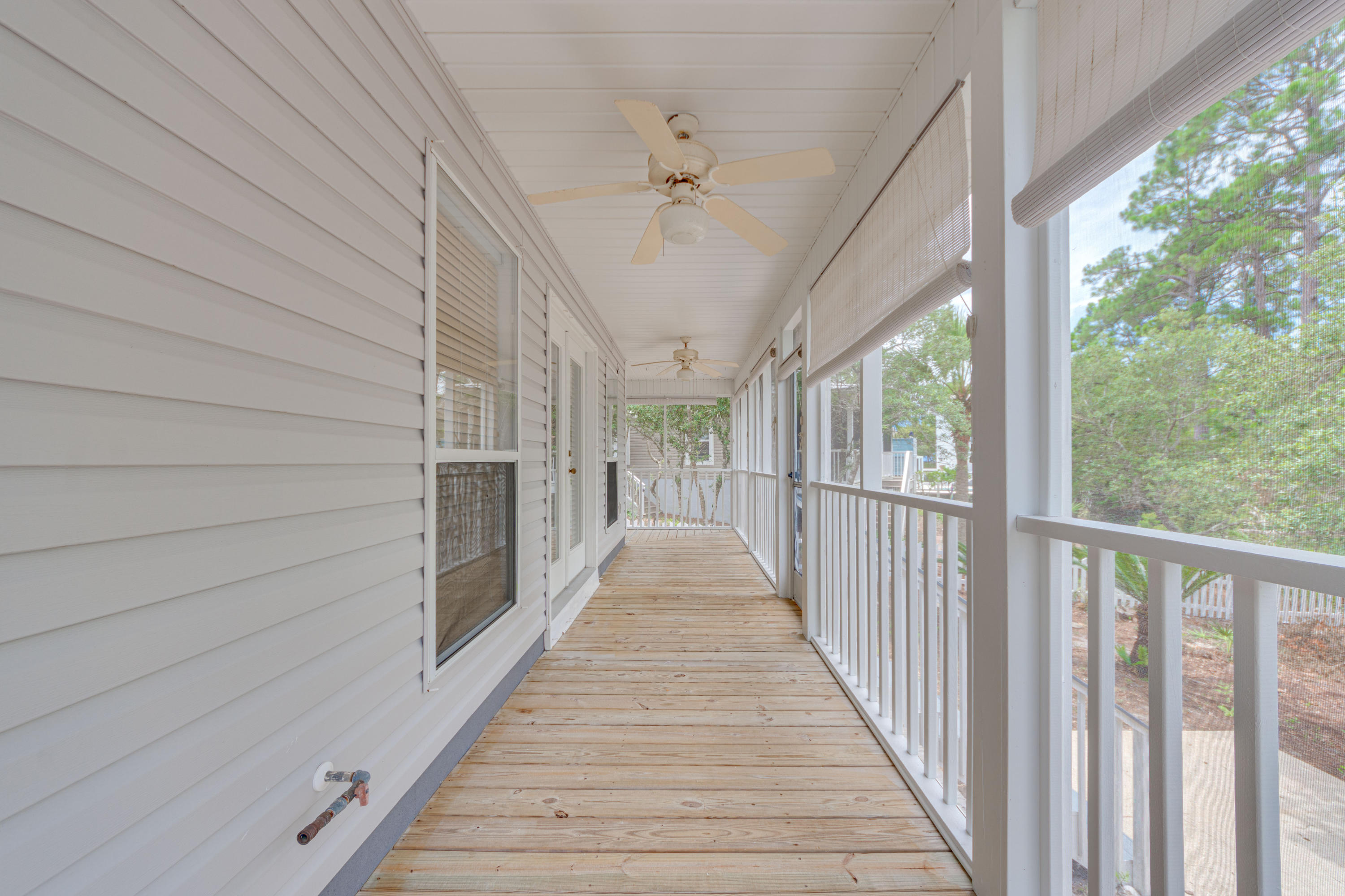 135 Gulfwinds Way Santa Rosa Beach, FL 32459 - Photo 47 of 51 a view of a porch with wooden floor and outdoor space