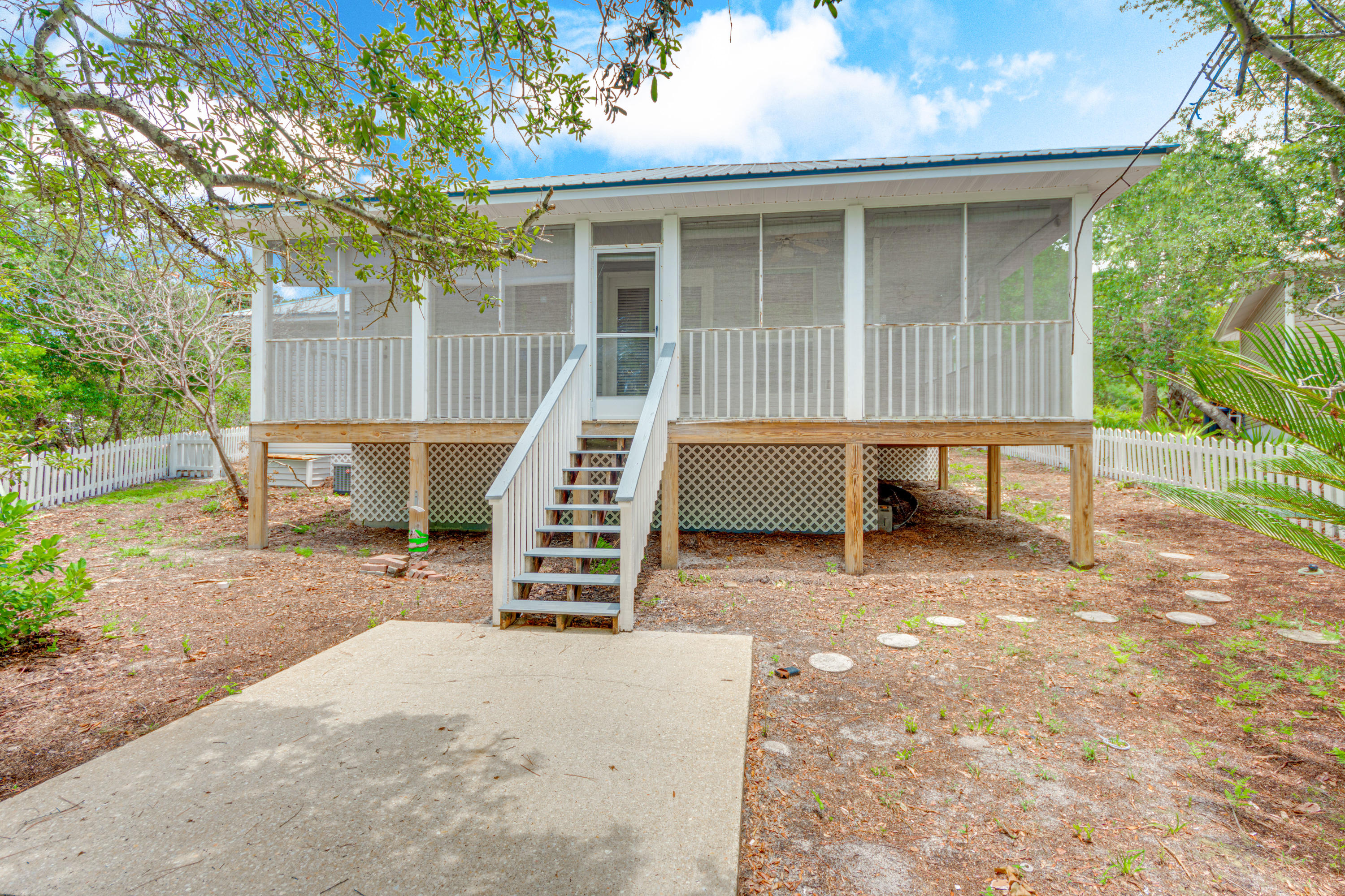 135 Gulfwinds Way Santa Rosa Beach, FL 32459 - Photo 50 of 51 a view of a house with backyard and sitting area
