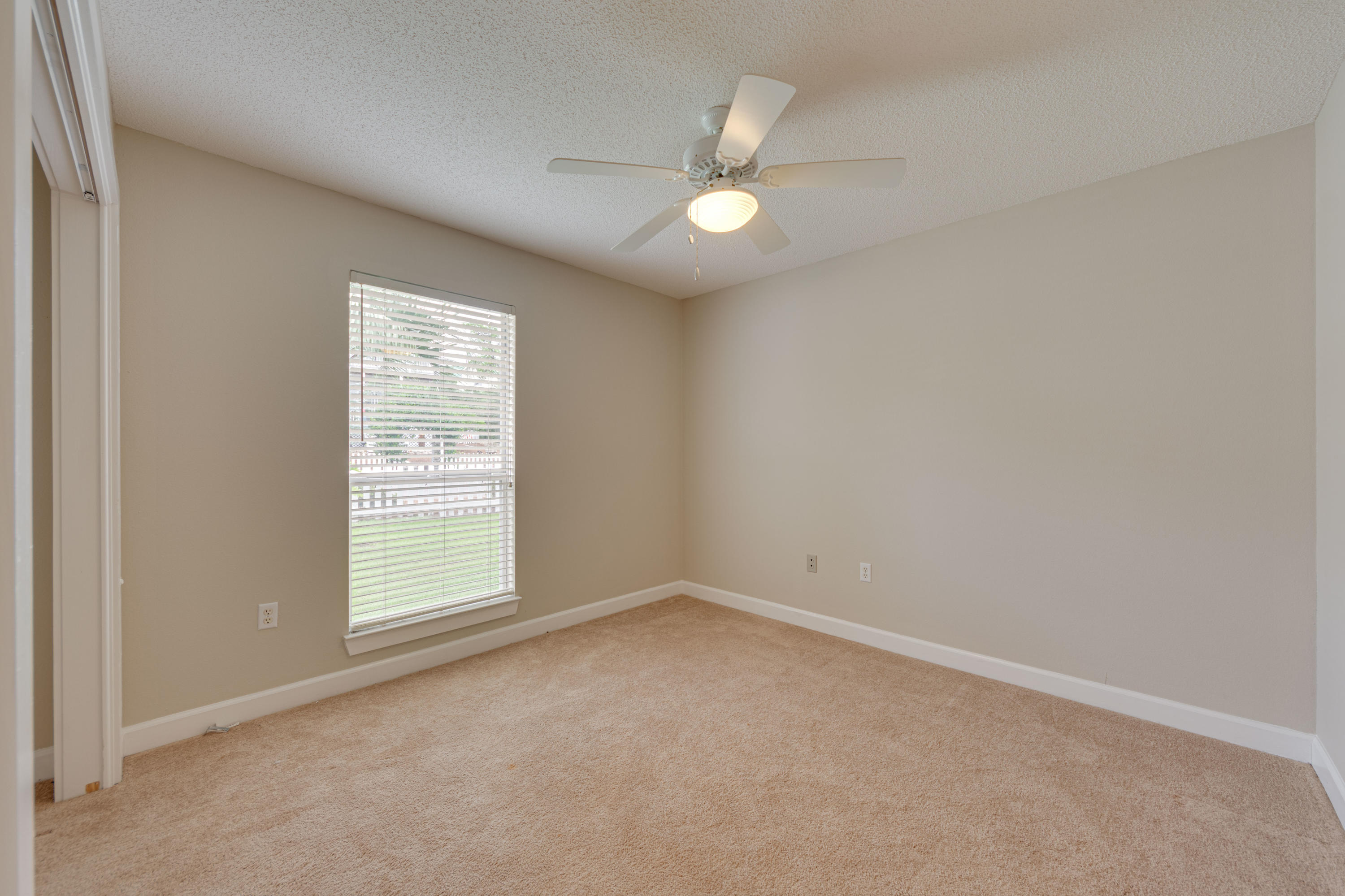 135 Gulfwinds Way Santa Rosa Beach, FL 32459 - Photo 5 of 51 an empty room with a window and a fan