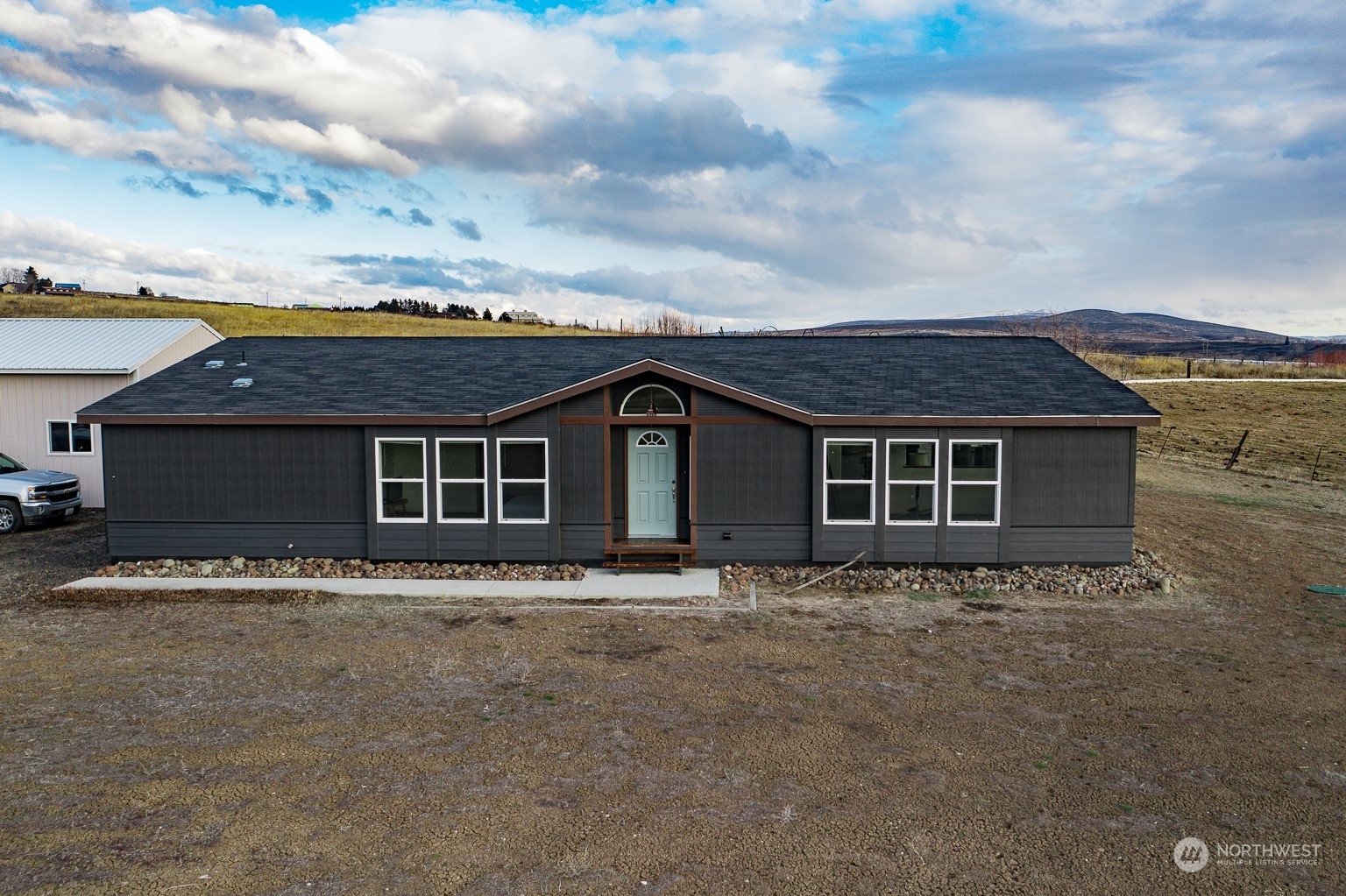 2416 Clerf Road Kittitas, WA 98926 - Photo 1 of 25 a front view of a house with a garden