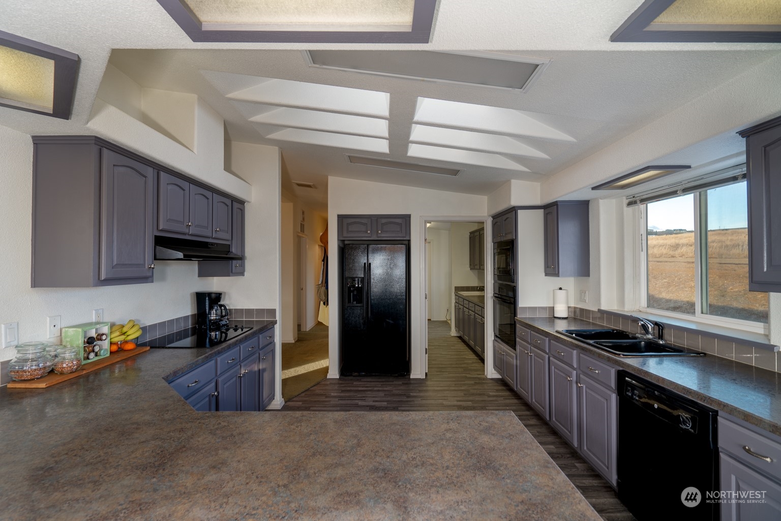 2416 Clerf Road Kittitas, WA 98926 - Photo 11 of 25 a kitchen with stainless steel appliances granite countertop a sink a stove and a refrigerator