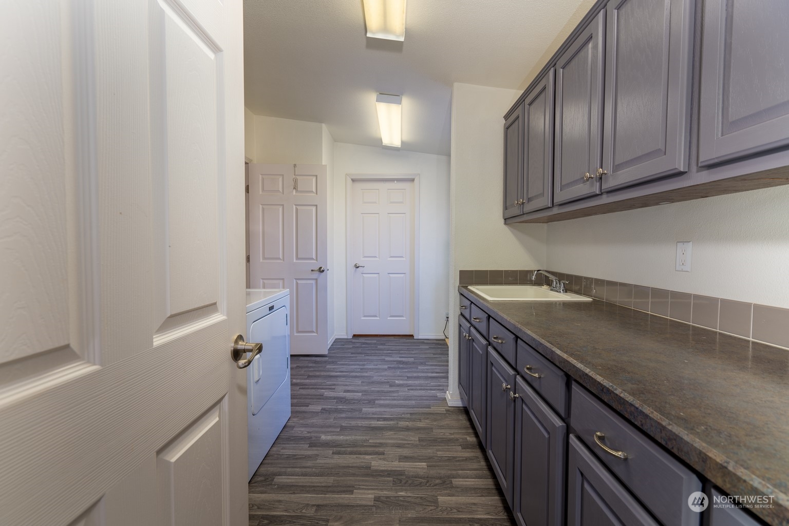 2416 Clerf Road Kittitas, WA 98926 - Photo 12 of 25 a kitchen with a sink and refrigerator