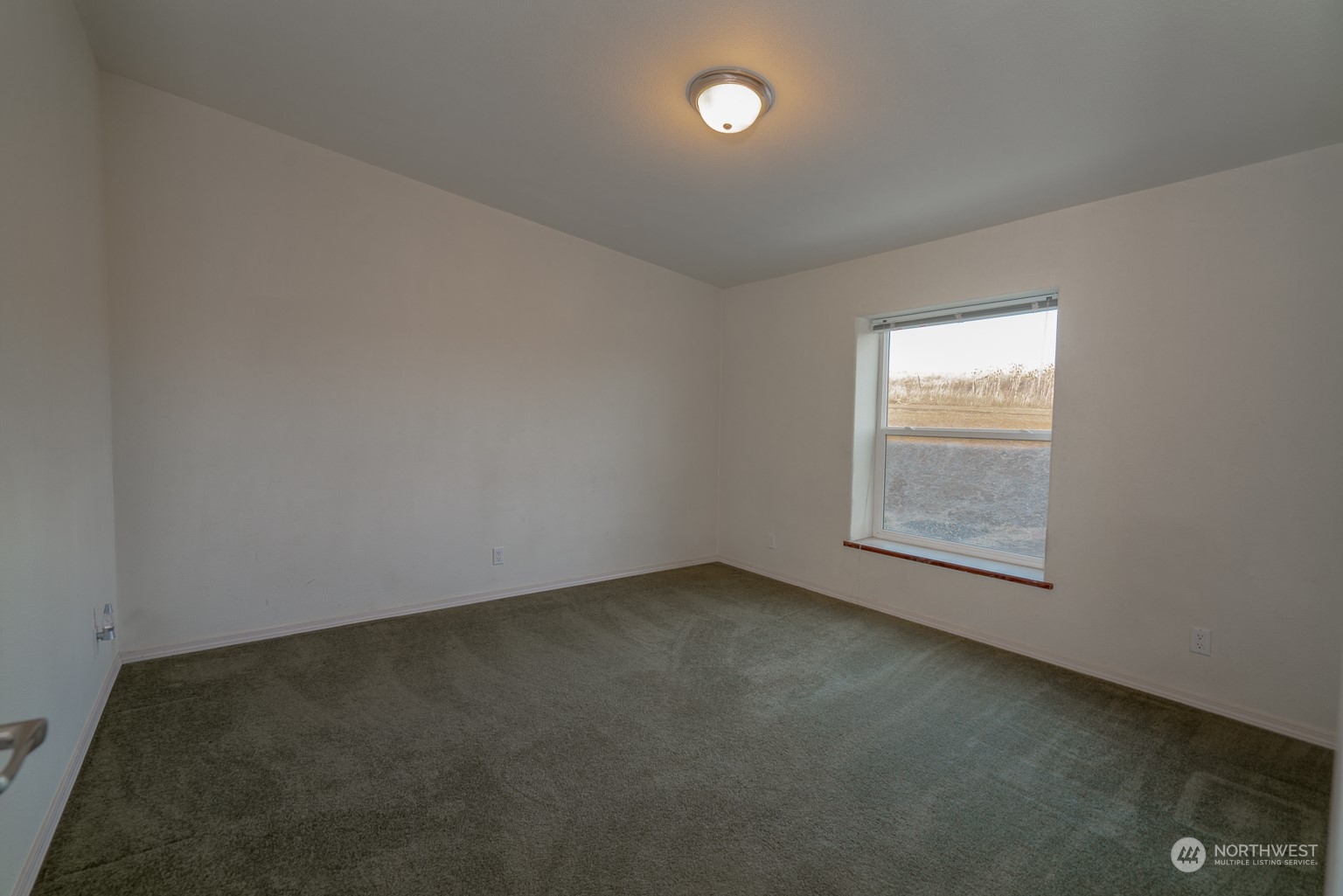 2416 Clerf Road Kittitas, WA 98926 - Photo 15 of 25 an empty room with a window