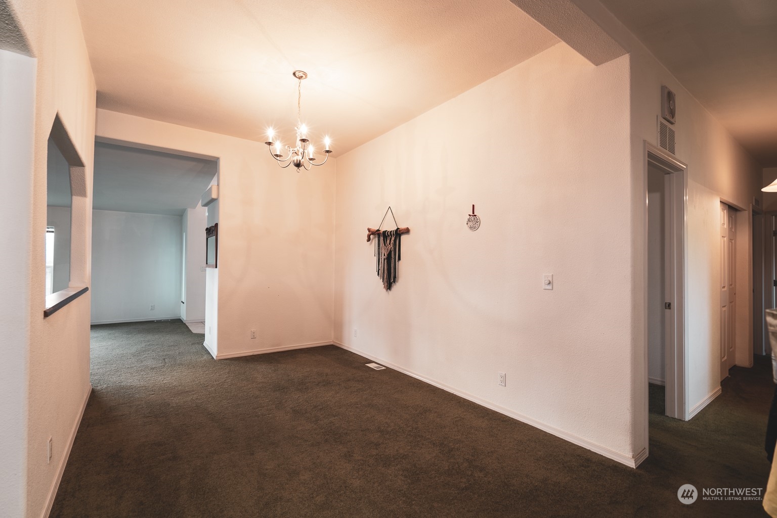 2416 Clerf Road Kittitas, WA 98926 - Photo 20 of 25 an empty room with chandelier fan and closet