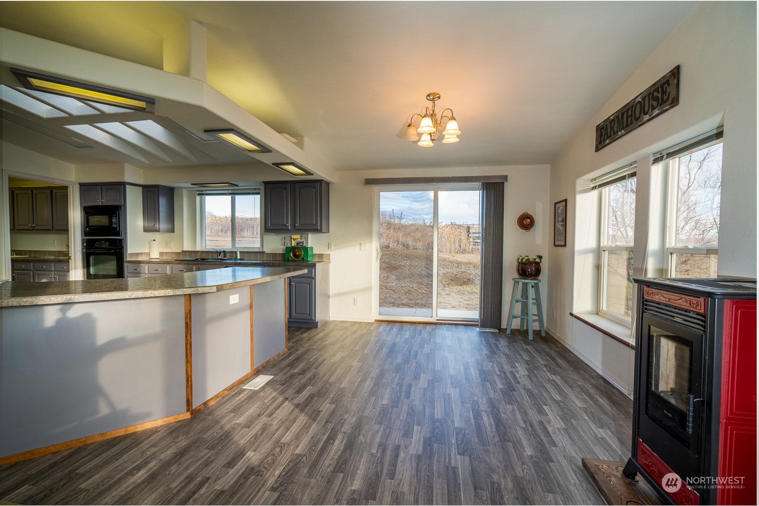 2416 Clerf Road Kittitas, WA 98926 - Photo 9 of 25 a large kitchen with a wooden floor and cabinets