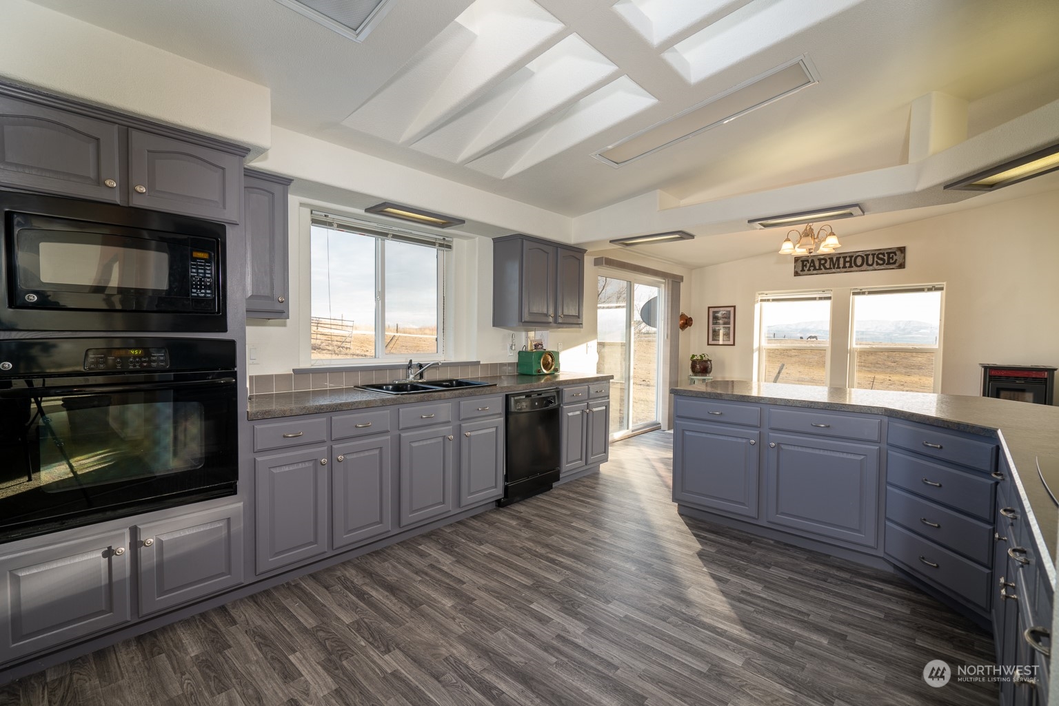 2416 Clerf Road Kittitas, WA 98926 - Photo 10 of 25 a large kitchen with granite countertop wooden cabinets stainless steel appliances a sink and a window