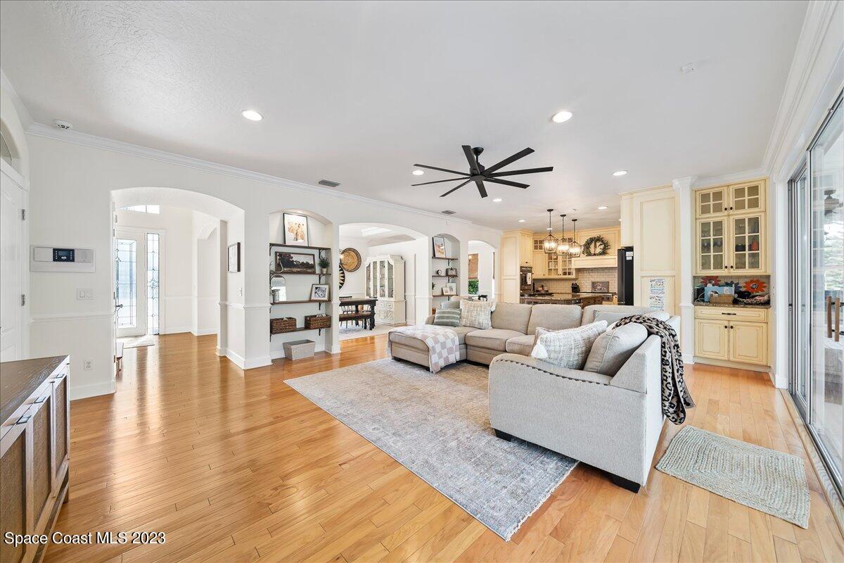 250 Baytree Drive Melbourne, FL 32940 - Photo 12 of 61 a living room with furniture or wooden floor and a large window