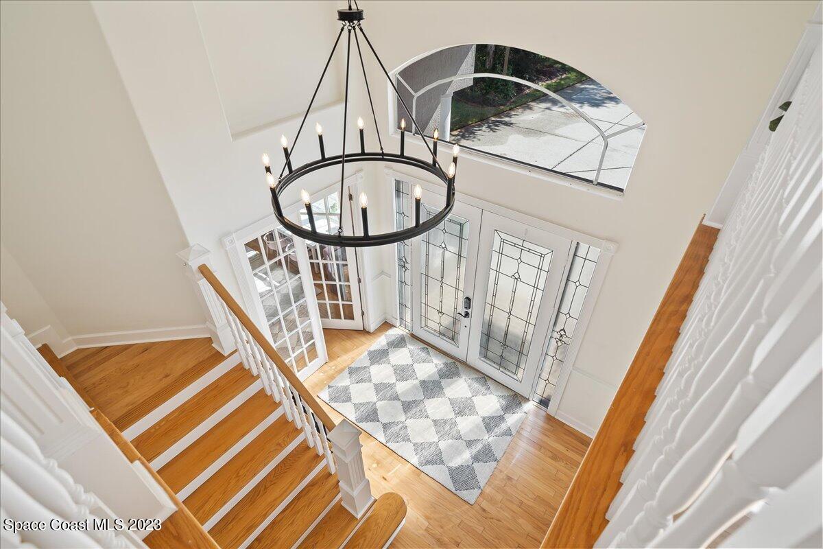 250 Baytree Drive Melbourne, FL 32940 - Photo 25 of 61 a view of a livingroom with wooden floor and stairs