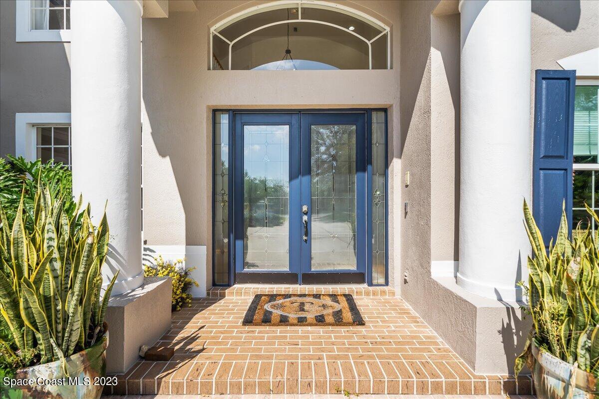 250 Baytree Drive Melbourne, FL 32940 - Photo 3 of 61 a view of a entryway door of the house