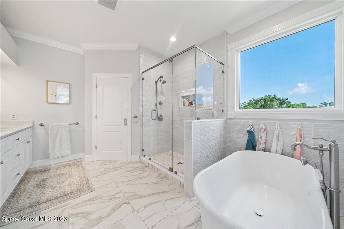 250 Baytree Drive Melbourne, FL 32940 - Photo 32 of 61 a bathroom with a sink toilet and shower