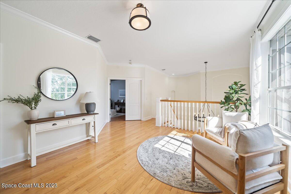 250 Baytree Drive Melbourne, FL 32940 - Photo 34 of 61 a living room with furniture a rug and a large window