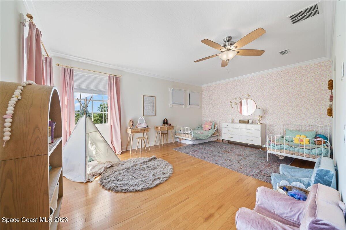 250 Baytree Drive Melbourne, FL 32940 - Photo 40 of 61 a living room with furniture and a wooden floor