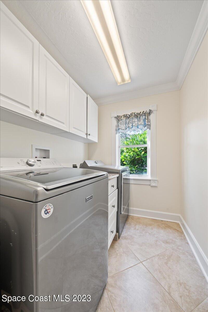 250 Baytree Drive Melbourne, FL 32940 - Photo 41 of 61 a kitchen with stainless steel appliances granite countertop a sink window and cabinets