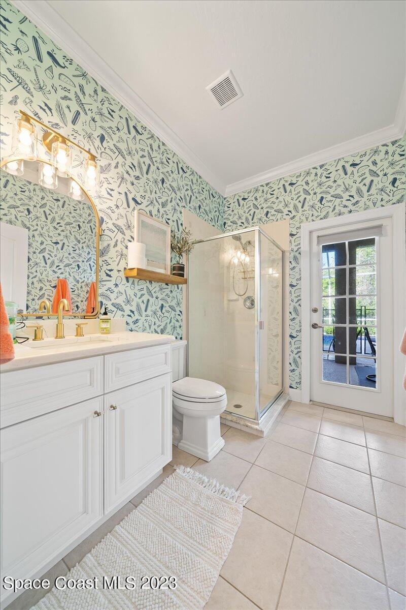 250 Baytree Drive Melbourne, FL 32940 - Photo 43 of 61 a bathroom with a granite countertop sink a toilet and a shower