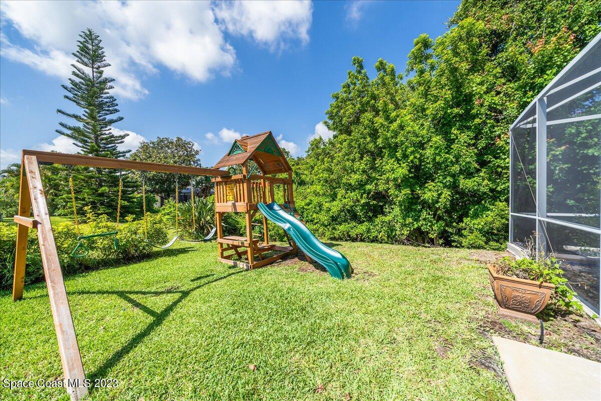 250 Baytree Drive Melbourne, FL 32940 - Photo 48 of 61 a view of a chair and table in the garden