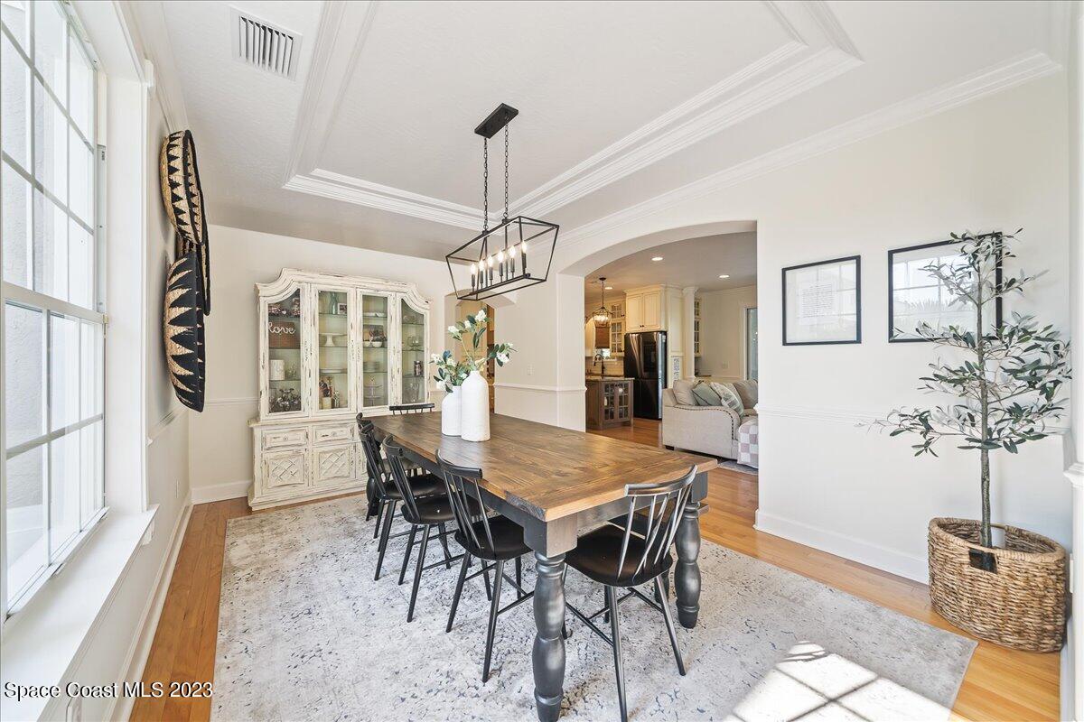 250 Baytree Drive Melbourne, FL 32940 - Photo 6 of 61 a view of a dining room with furniture and wooden floor