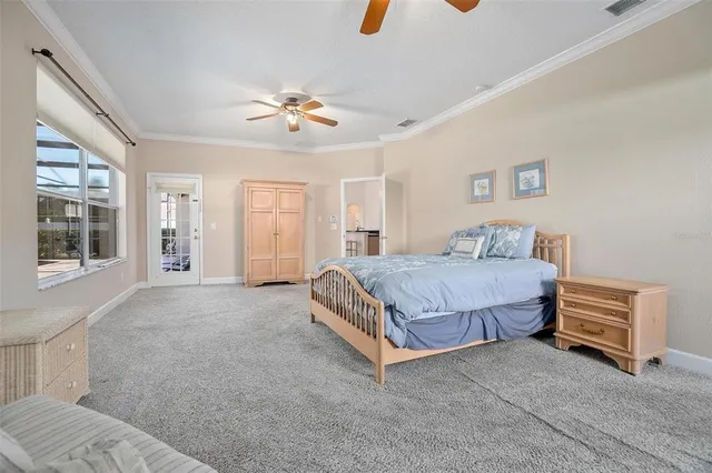 a bedroom with a large bed closet and window