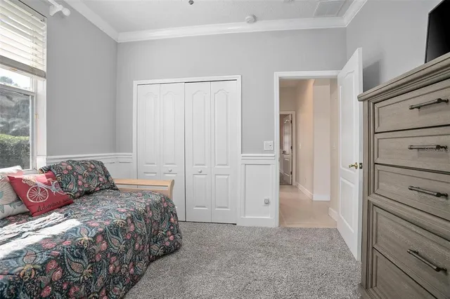a bedroom with a bed and a closet