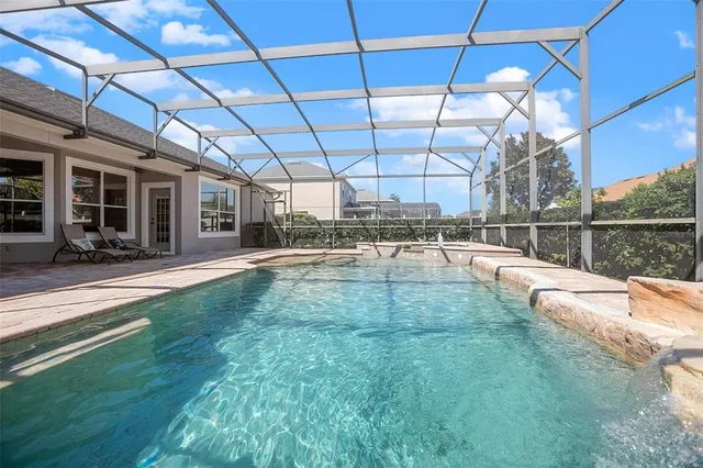 a view of a swimming pool with a patio