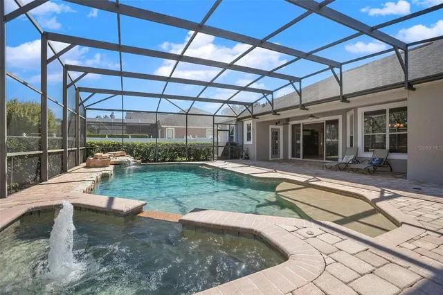 a view of a swimming pool with a patio
