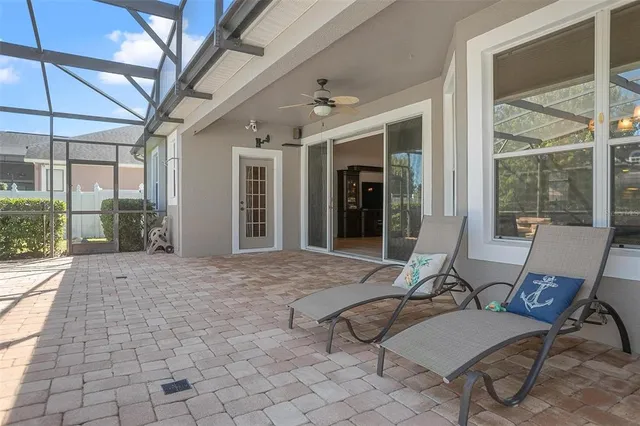 a view of a patio with a dining table and chairs