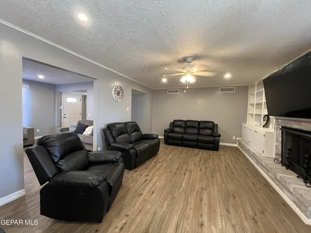 a view of a kitchen with kitchen island a sink table and chairs