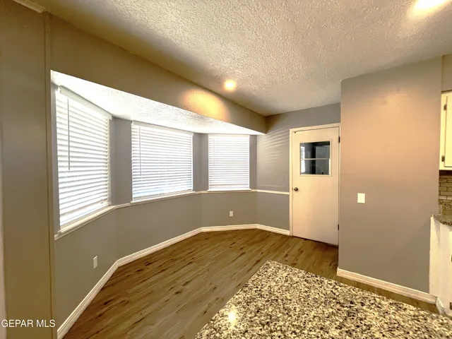 a kitchen with stainless steel appliances white cabinets and a sink