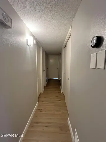 a bedroom with a bed and a desk