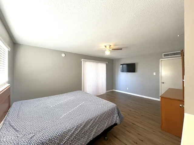 a bathroom with a toilet and shower curtain