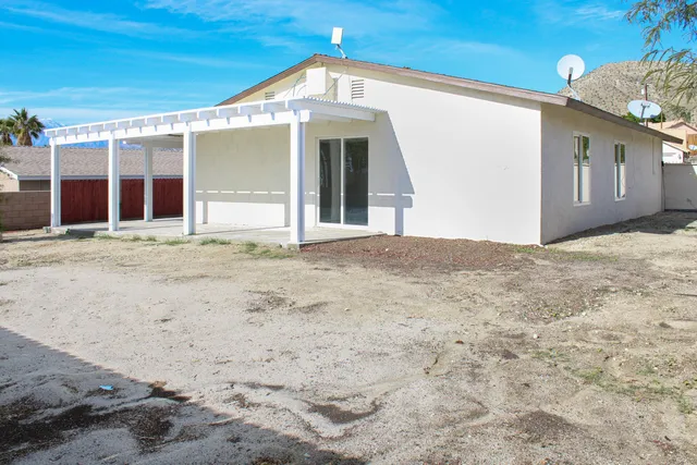 a view of a house with a snow in front of it