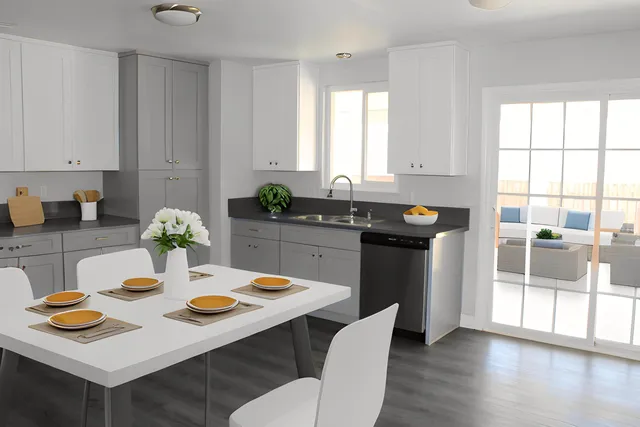 a kitchen with a table and chairs in it