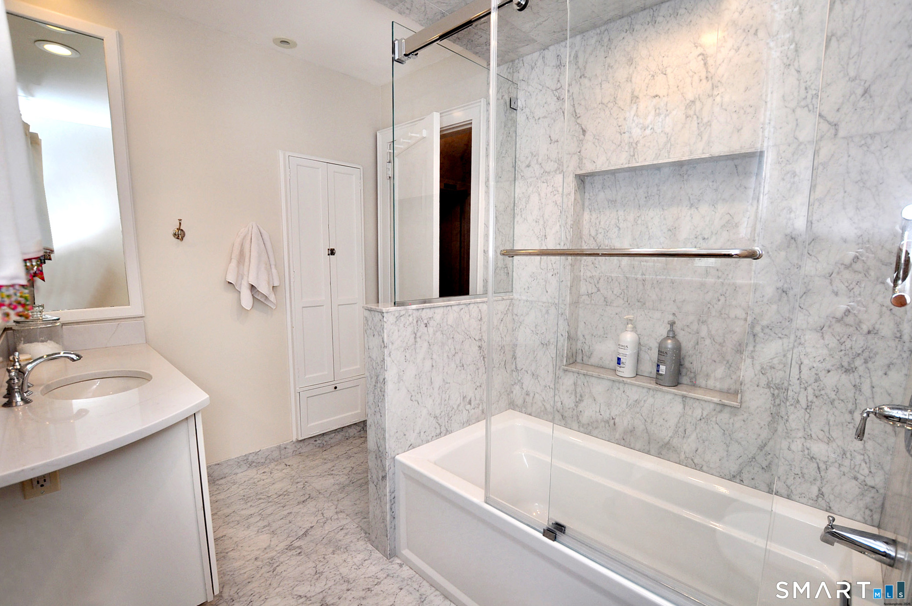 371 North Main Street Suffield, CT 06078 - Photo 27 of 39 a bathroom with a tub sink and mirror