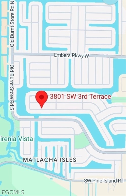 3801 Southwest 3rd Terrace Cape Coral, FL 33991 - Photo 3 of 3 a utility room with a fridge and a window