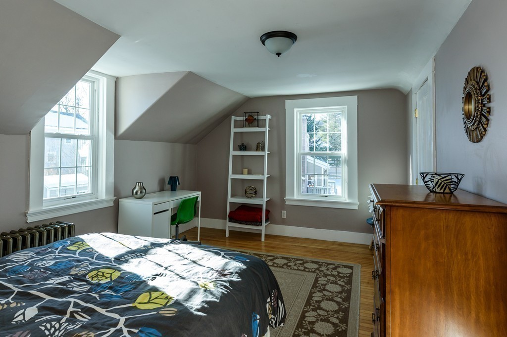 68 Maple Street Boston, MA 02132 - Photo 14 of 19 a bedroom with a bed and a window