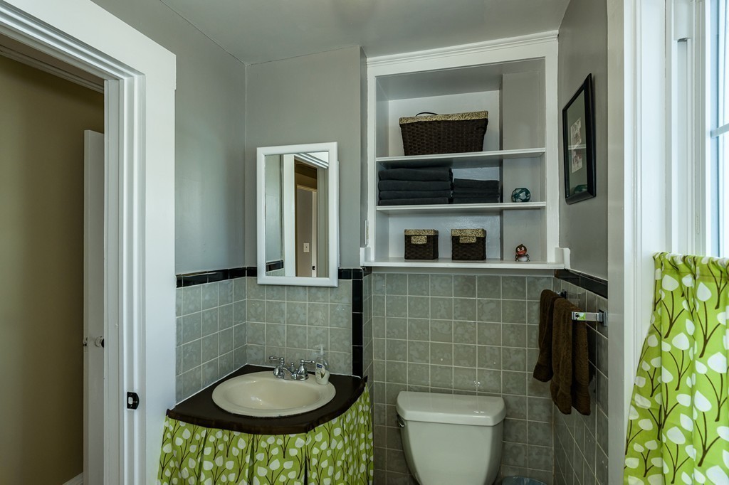 68 Maple Street Boston, MA 02132 - Photo 15 of 19 a bathroom with a toilet and a sink