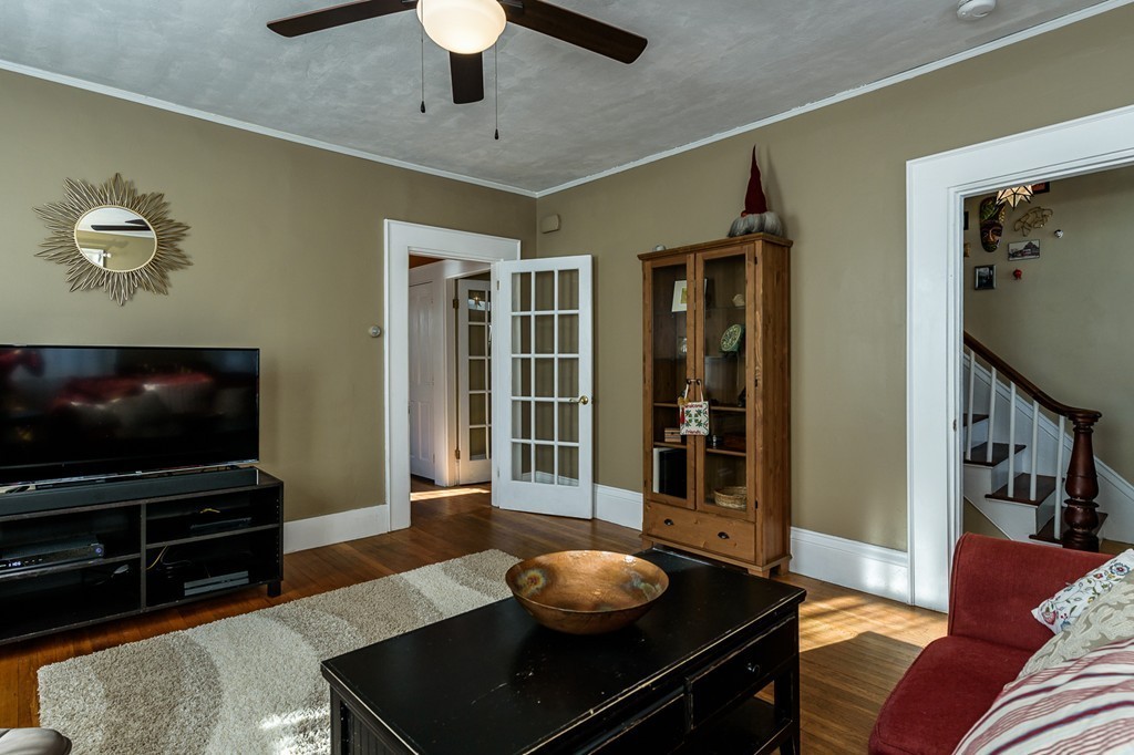 68 Maple Street Boston, MA 02132 - Photo 5 of 19 a living room with furniture and a flat screen tv