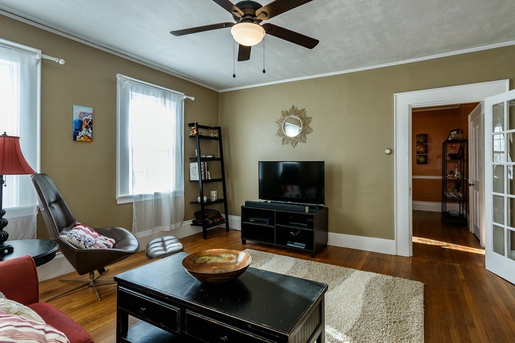 68 Maple Street Boston, MA 02132 - Photo 6 of 19 a living room with furniture and a flat screen tv