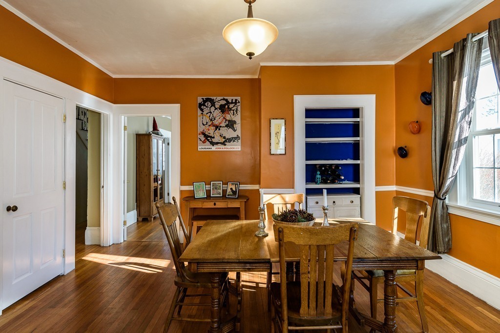 68 Maple Street Boston, MA 02132 - Photo 7 of 19 a view of a dining room with furniture and wooden floor