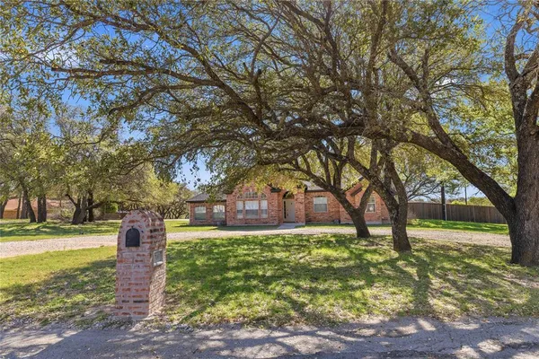 a view of a house with a big yard