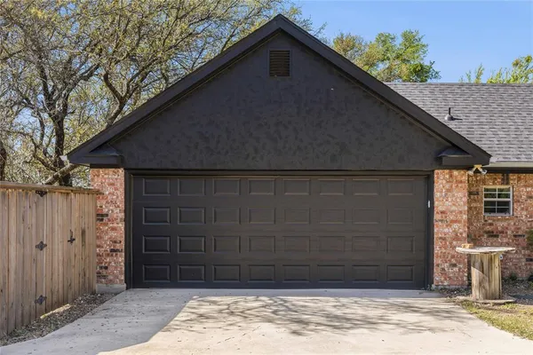 a couple of potted plants in front of door