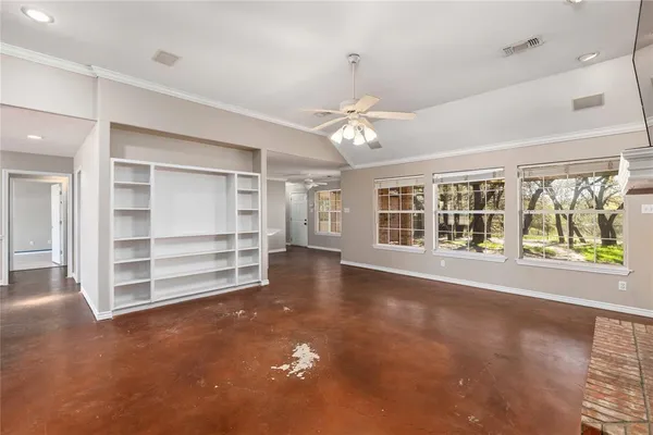 a view of an empty room with a window